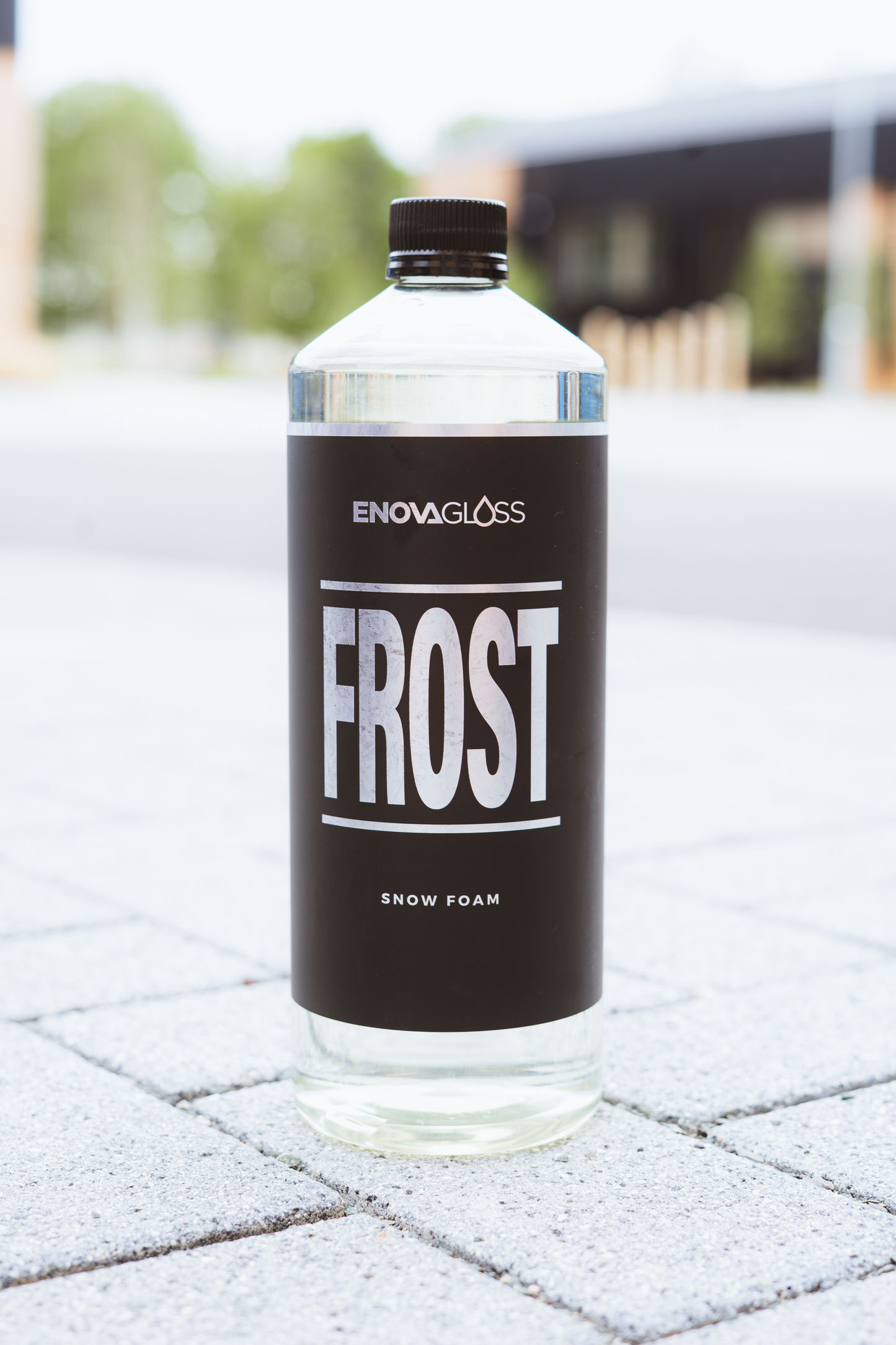 Bottle of Enoval Gloss Frost Snow Foam on a frosty pavement
