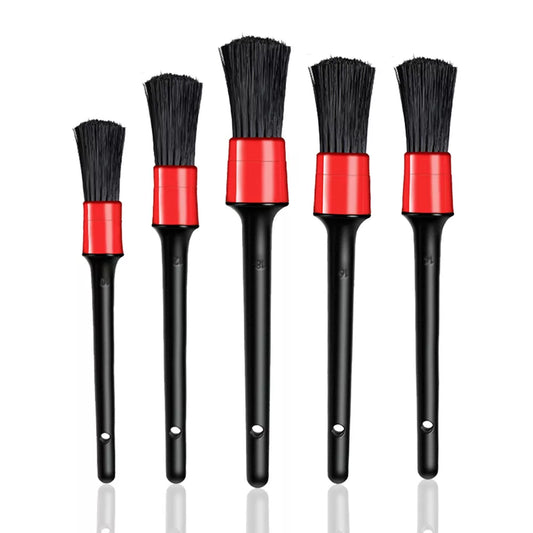 Set of five black and red brushes on a white background